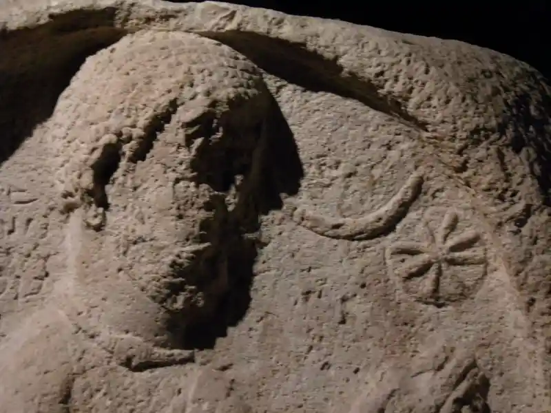 Parthian stele from Ashur, solar disc, cross with rays